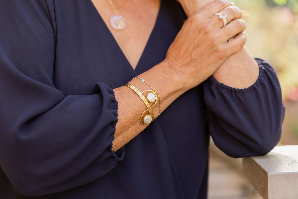 2 Stone Pearl squeeze bracelet and rose quartz rhodium ring on model.jpg__PID:616ad4dd-72b2-43aa-a438-de8d93a7bd9b