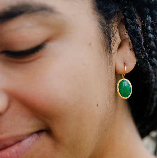 Woman holding a pink flower with a 24K Gold Filled Jade Earrings 