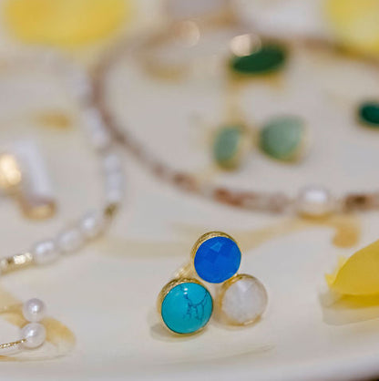 Jewelry set including earrings and a necklace on a decorative plate with yellow flowers. 3 Stone Stone Turquoise, Blue Quartz, Moonstone Ring Small (24k gold fill)
