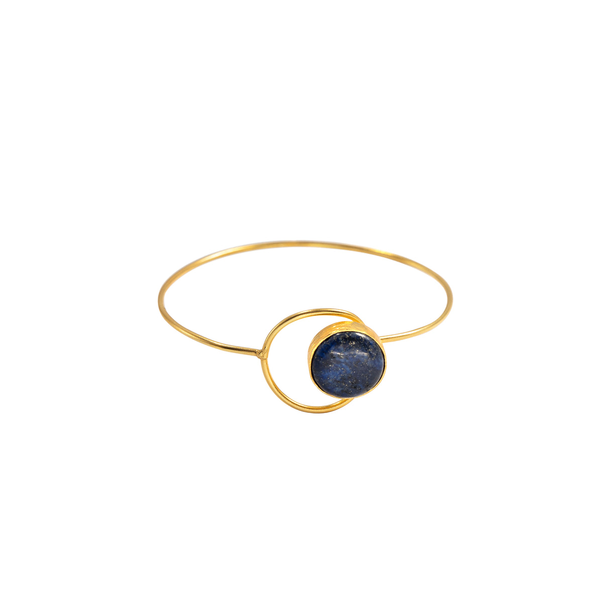 A gold bangle bracelet featuring a central circular gold ring and a dark blue, textured stone inlay, shown against a plain white background.