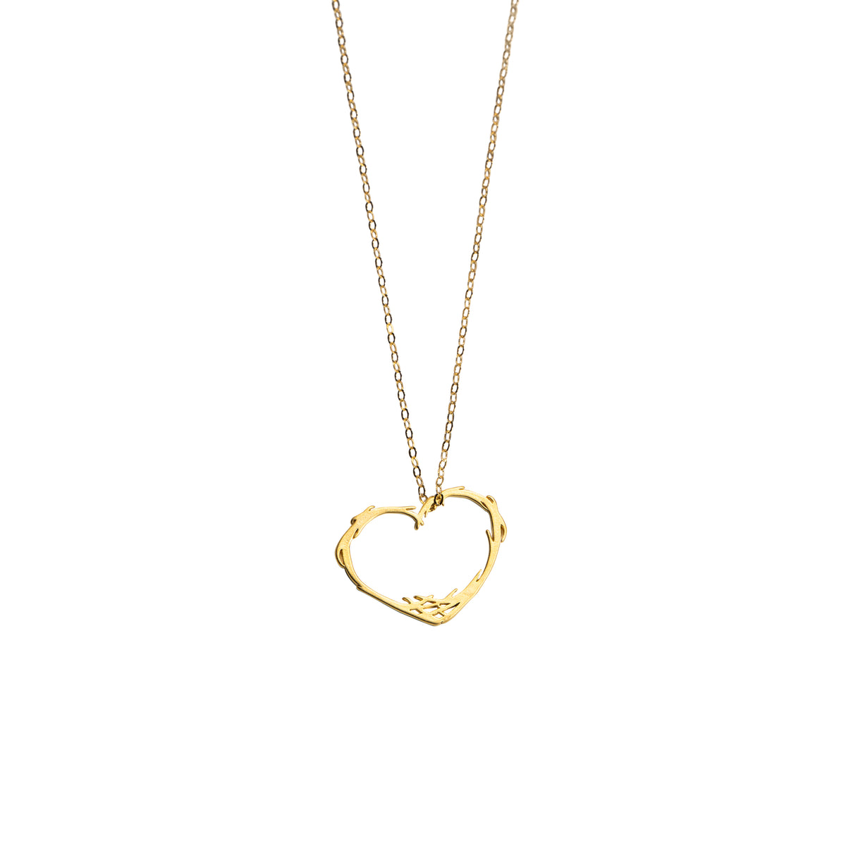 A gold chain necklace featuring a textured, open heart-shaped pendant, presented on a clean white background.