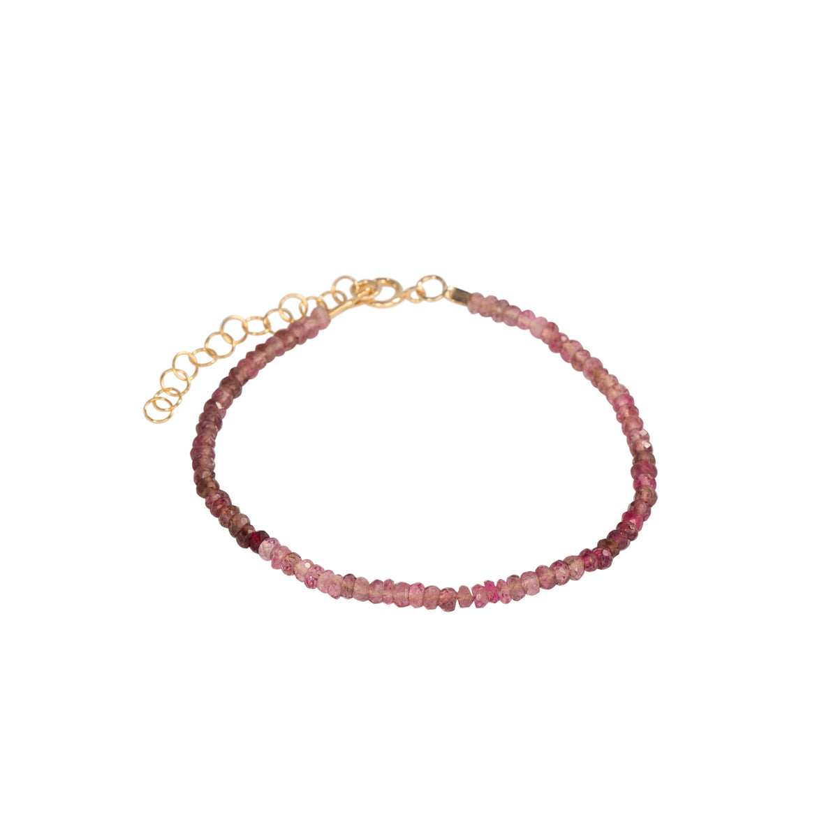A delicate beaded bracelet featuring small, faceted pinkish-red beads strung on a gold-toned chain with an adjustable lobster clasp and extension links, shown against a plain white background.