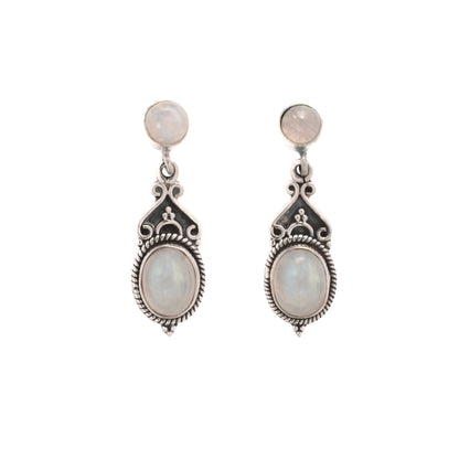 Pair of silver earrings with moonstone stones on a white background