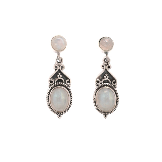 Pair of silver earrings with moonstone stones on a white background